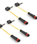 Brake pad sensor lines, 4-piece set in black with yellow wires and red end caps, angled view