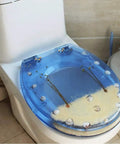 Hella Durable Round Resin Toilet Seat With Crystal Clear Aquarium Vibe And Smooth Sit Ergonomic Comfort Featuring Rock Solid Metal Hinges For A Top Tier Bathroom Setup That Looks Absolutely Sick, featuring blue resin and aquatic decor.