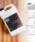 High End Water Based Stone Sealant For Granite Marble Concrete And Grout in a 1-gallon bottle on a marble background.