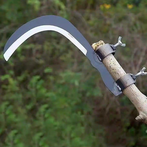 Durable Manganese Steel Blade Sickle With Replaceable Wooden Handle, mounted on wooden stick, in garden setting, side view