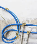Installed Six Pack 1/2 Inch Push Fit Tee Fittings With Disconnect Clip For Copper PEX CPVC Pipes in blue tubing system