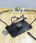 Beefy Magnetic Helping Hands Soldering Station with Heavy Duty Metal Base, Six PCB Holders, Five Arms, Alligator Clips in use