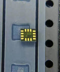 Two ICM-42688P 6 Axis Motion Sensor ICs With Built In Gyroscope And Accelerometer In LGA-14 SMT Package For Easy Go-To PCB Integration Perfect For DIY Robotics Drones And Wearables, close-up of LGA-14 chip on tray