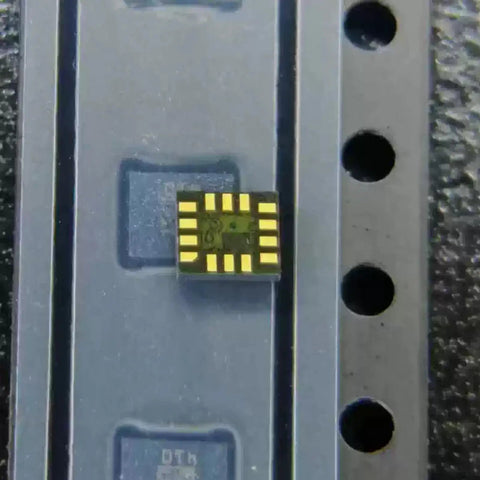 Two ICM-42688P 6 Axis Motion Sensor ICs With Built In Gyroscope And Accelerometer In LGA-14 SMT Package For Easy Go-To PCB Integration Perfect For DIY Robotics Drones And Wearables, close-up of LGA-14 chip on tray