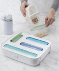 StoraBag Drawer Food Bags Dispenser For Kitchen Storage 4 Slot Plastic Sandwich Bag Organizer with bags partially loaded
