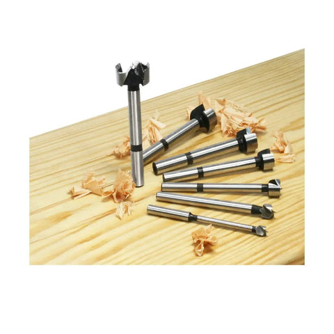 Forstner Bit Set Seven Pieces One Quarter Inch To One Inch Diameter Three And A Half Inch Length Right Hand Rotation Shank One Quarter To Three Eighths Inch Ultra Sharp Spurs Pro Grade Forged Construction For Clean Flat Bottom Holes on wood surface