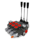 Monoblock hydraulic directional control valve, three-spool, SAE ports, front view with red port caps and three levers.