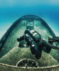 Underwater diver wearing Zen Deluxe Single Tank Scuba BCD With Narrow Zen Wing exploring sunken shipwreck.