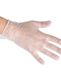 Close-up of a hand wearing Two Hundred Disposable Vinyl Gloves Non Sterile Powder Free Smooth Touch Food Service Grade Large Size Ambidextrous Pack Of 2x100 Water Resistant For Cleaning And Food Prep Workhorse Kitchen Gloves.