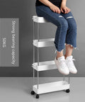 Person sitting on No Sweat Rolling Utility Cart With Smooth Slide Out Storage Rack And Reinforced Hook Compact Mobile Shelving Organizer.