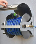 Tough As Nails Retractable Hose Reel Cart Crafted From Heavy Duty Stainless Steel wall mount with blue garden hose.