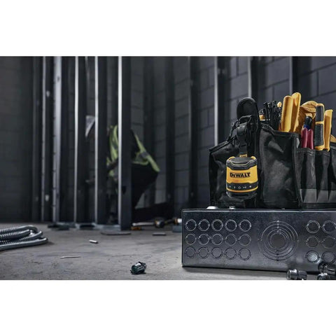 Rugged Jobsite Bluetooth Speaker With USB C Rechargeable Battery IP67 seen in a construction setting with tools and equipment.