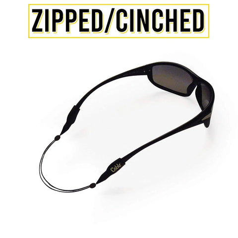 Monoz Adjustable Eyewear Retainer With Monofilament Like Line Off The Neck 14 Inch Black Non Conductive Eyewear Retainer for Work and Everyday All Day Comfort shown attached to sunglasses.