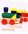 Miniature Wooden T Nails For Crafts And Woodworking With Ergonomic T Head Design next to colorful wooden toy train on a white surface