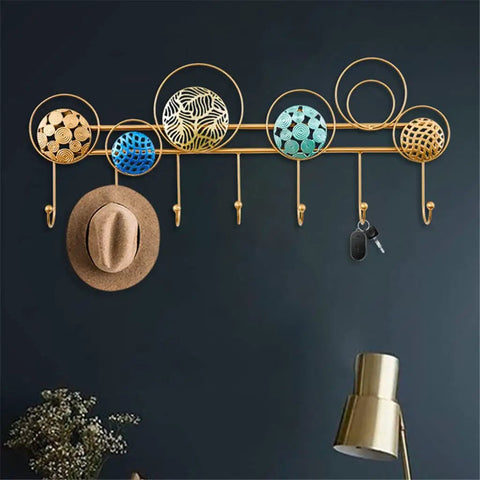 Heavy Duty Wrought Iron Wall Decor With A Dope Partition Rack And Coat Hook This Hand Painted Blue Gold Storage Organizer with hooks and circular designs.