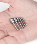 Hard Alloy Screw Nail Weights Set For Bass Fishing Die Cast Sinker Assortment In Six Sizes, shown on a hand