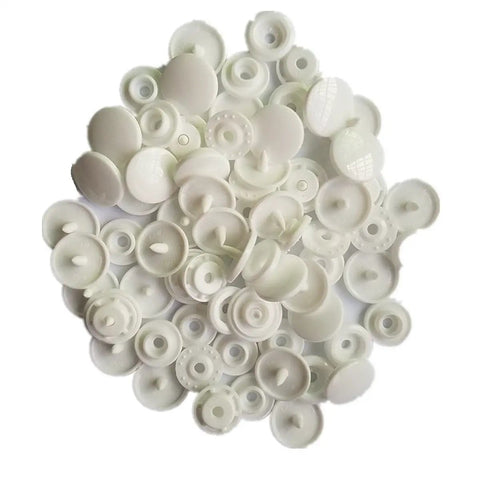 White plastic snaps pile from Handheld Plastic Snap Pliers Kit For Quick No Sew Fasteners Includes 100 White Plastic Snaps Size 20 22 24 T5 Dies Awl And Punch For Quick Garment Crafting Bags And Diy Projects.
