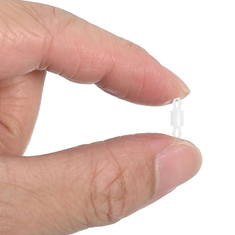 Hand holding a small 4mm nylon PCB standoff from the 200 Pcs Nylon Double Head Reverse Lock PCB Standoffs.