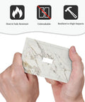 Absolute Game Changer With This Sleek Gray White Marble 1 Gang Switch Cover held in hand, showcasing unbreakable material and design.