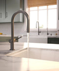 hansgrohe Talis N Pull Down Kitchen Faucet, Modern, Magnetic Hand Sprayer, 1-Handle, 1.75 GPM, Brushed Black Chrome water stream in kitchen.