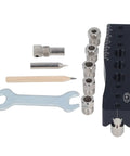 Knockout Centering Dowel Jig For Woodworkers With Rock Solid Aluminum Build, includes metal pieces, wrench, and pencil for precise drilling.