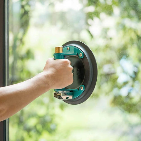 8 Inch Glass Vacuum Suction Cup With Metal Handle And Brass Pump in use on flat glass surface