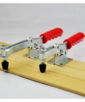 Heavy Duty Horizontal Toggle Clamp Metal Plunger Push Pull Fixture For Welding And Garage Builds with red handles on wood.
