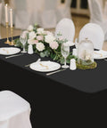 Two Pack Spandex Tablecloths 6 Ft Elastic Fitted Stretch Rectangular Patio Table Cover For Outdoor Tables Wrinkle Free And Washable Black 72x30x30 With Four Elastic Leg Pockets For Outdoor Parties And Weddings displayed at an event.