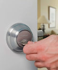 SmartKey Security Exterior Deadbolt With Keyed Entry In Satin Nickel Model 980 Quick Rekey In Seconds being locked on door