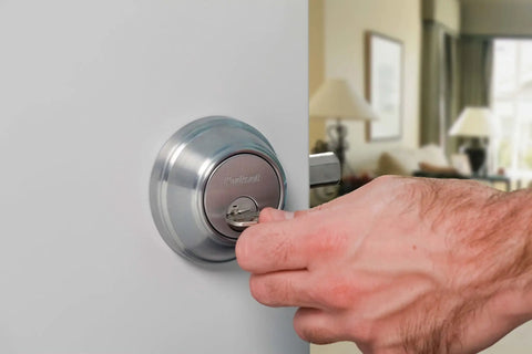SmartKey Security Exterior Deadbolt With Keyed Entry In Satin Nickel Model 980 Quick Rekey In Seconds being locked on door