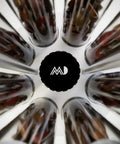 Top view of Eight Single Dose Espresso Bean Storage Tubes With Rotating Display Rack And Precision Funnel Set, showcasing glass tubes.
