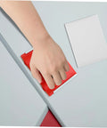 Hand using Two Pack Paint Edger Pad Refills For Deck Stain And Wall Painting Easy Swap Replacement Pads with red handle