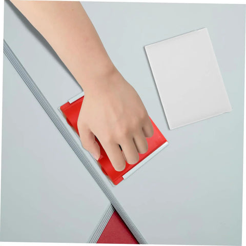 Hand using Two Pack Paint Edger Pad Refills For Deck Stain And Wall Painting Easy Swap Replacement Pads with red handle
