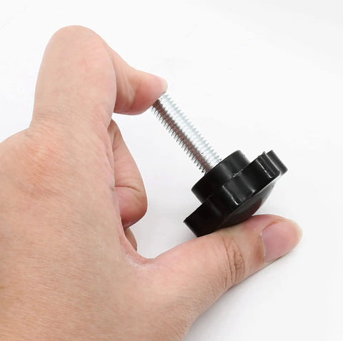 Four Pack Of M8 Threading Star Hand Knob Screws Featuring Rugged Plastic And Steel Knobs in hand, showcasing durable design and threaded shaft.