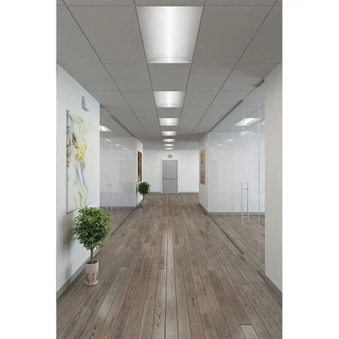 Emergency APC7R Combo Unit LED Exit Sign with Dual Lights in hallway with modern decor, showing red letters and damp location suitability.
