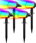 Color Changing Outdoor Solar Spot Lights 7 Modes 4 Pack IP65 Waterproof showing vivid color beams in a garden setting.