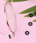 Close-up of glasses frame with silicone rings, part of Glasses Repair Kit With Hinge Tighteners, Frame Grips And Silicone Rings.