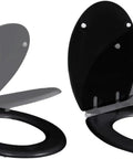 Dual Pack Toilet Seat Set Featuring Silent Soft Close Lids And Sturdy Mdf Build With Smooth Glide Mechanics And Matte Black Hardware, shown at an angle.
