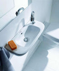 D Code Hand Rinse Basin With Overflow, rectangular deck mounted sink with rear drain and left side faucet hole in modern bathroom