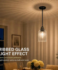 HXXLFONEDP 3 Pack Kitchen Island Pendant Lights, Ribbed Glass, Black hanging above a dining table, showcasing warm lighting.