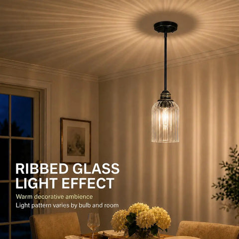 HXXLFONEDP 3 Pack Kitchen Island Pendant Lights, Ribbed Glass, Black hanging above a dining table, showcasing warm lighting.
