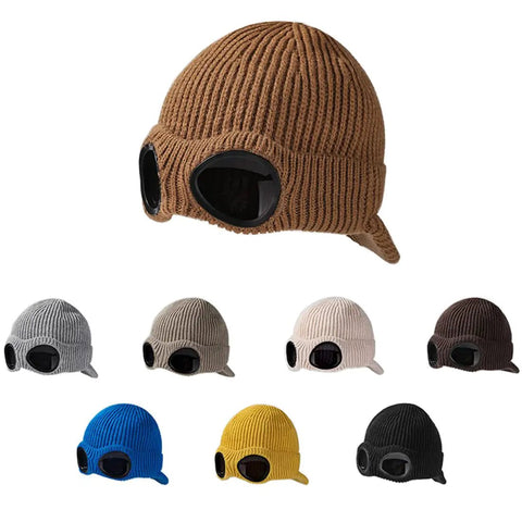Multiple unisex peak ski beanies with thick fleece lining in various colors. Cozy knit for winter, one size fits most, durable acrylic knit.