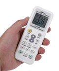 Person holding Universal LCD Remote For Air Conditioners All In One 1000 In 1 Controller Works With Most Brands Easy Setup English Manual Included Requires 2 AAA Batteries Backups For Home Comfort showing 26 degrees on screen.