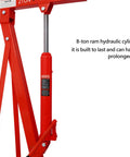 Hella Sturdy Heavy Duty Hydraulic Engine Hoist Crane Two Ton Four Thousand Pounds Capacity Folding Cherry Picker With Six Swivel Casters For Garage Work Red close-up of 8-ton ram hydraulic cylinder in red.