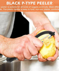 Front view of a black crinkle cutter with onion holder and stainless steel wavy blade slicing a potato.