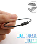 Hand holding a black stainless steel wire keychain, 20 Pcs Black Stainless Steel Wire Keychains 1.5mm Thick Elastic Wire Rope Loops 5.9 Inches Long Heavy Duty Durable Luggage Tag Rings Cable Loops For Keys Bags Travel Gear Diy Projects, close-up of wire detail