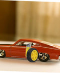 Orange toy car with Electric Motor And Plastic Tire Wheel Set For RC Cars And Trucks next to it, showcasing easy assembly wheels.