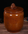 Big Boy Ceramic Rice Jar With Rattle Proof Lid Heavy Duty Porcelain Kitchen Dispenser To Keep Your Grains Coffee Flour And Nuts Fresh Vintage Brown Bulk Pantry Vault, angled view on wooden surface.