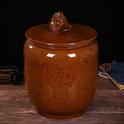 Big Boy Ceramic Rice Jar With Rattle Proof Lid Heavy Duty Porcelain Kitchen Dispenser To Keep Your Grains Coffee Flour And Nuts Fresh Vintage Brown Bulk Pantry Vault, angled view on wooden surface.