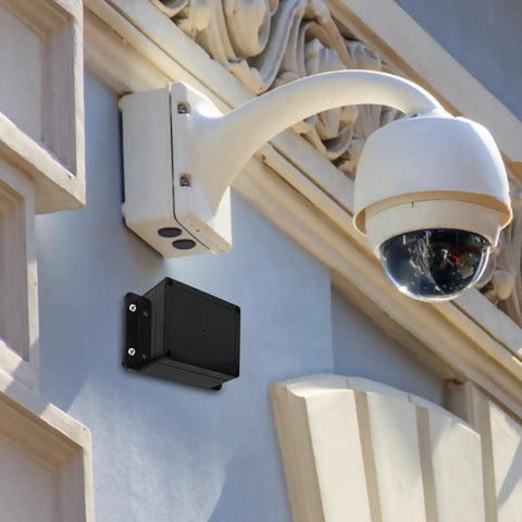 Waterproof Electrical Junction Box Enclosure 115x90x55mm with Mounting Ear installed outdoors near security camera